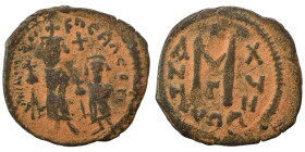 Arab-Byzantine. Circa 640-650. Imitating 'Cyprus follis of Heraclius", 610-641. Follis (bronze, 4.58 g, 25 mm), Uncertain mint in Syria. Three standin...
