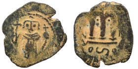 Arab-Byzantine, Umayyad Caliphate, circa 641-660. Fals (bronze, 3.43 g, 21 mm). Imitative of Constans II, standing imperial figure, holding globus cru...