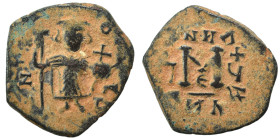 Arab-Byzantine, Umayyad Caliphate, circa 641-660. Fals (bronze, 3.97 g, 23 mm). Imitative of Constans II, standing imperial figure, holding globus cru...