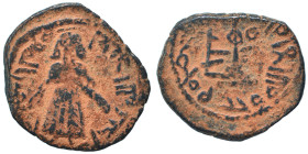 Arab Byzantine. Umayyad Caliphate. al-Malik ibn Marwan, AH 65-86 / 685-705 AD. Fals (bronze, 2.99 g, 21 mm), 'Standing Caliph' type. Caliph standing f...