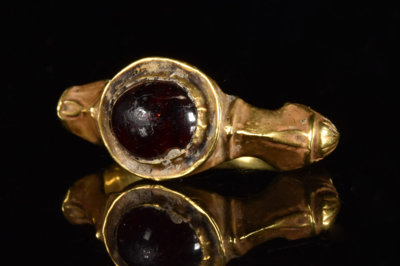 HELLENISTIC GOLD RING WITH GARNET

 Ca. 400-200 BC
 A gold finger ring compos...