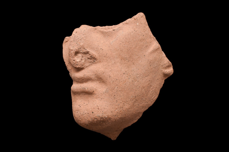 ETRUSCAN TERRACOTTA ACROTERION FRAGMENT OF THE FACE OF HERCLE

 Ca. 5th-2nd ce...