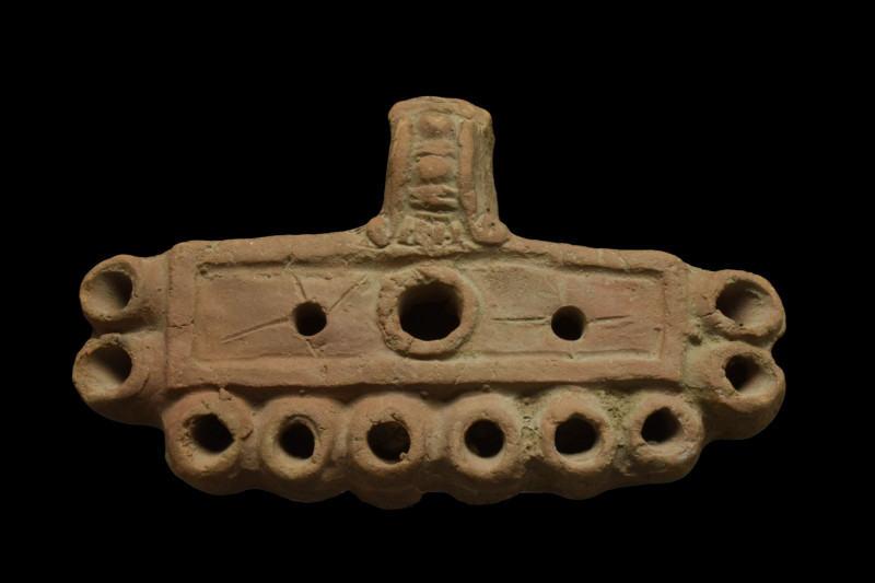 ROMAN TERRACOTTA TEN-SNOUTED OIL LAMP

 Ca. 100-300 AD
 A rare example of a t...