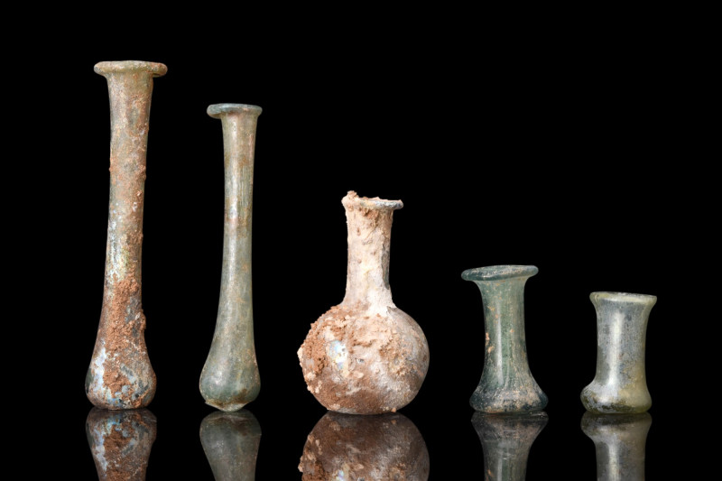 COLLECTION OF FIVE ROMAN GLASS BOTTLES

 Ca. 100-300 AD
 A group of five glas...