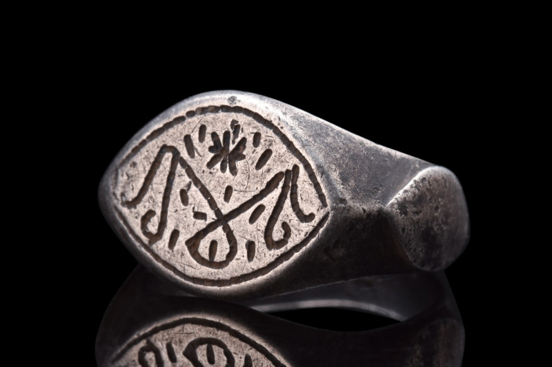 SELJUK SILVER FINGER RING

 Ca. 1100 AD
 Crafted from silver, this ring featu...