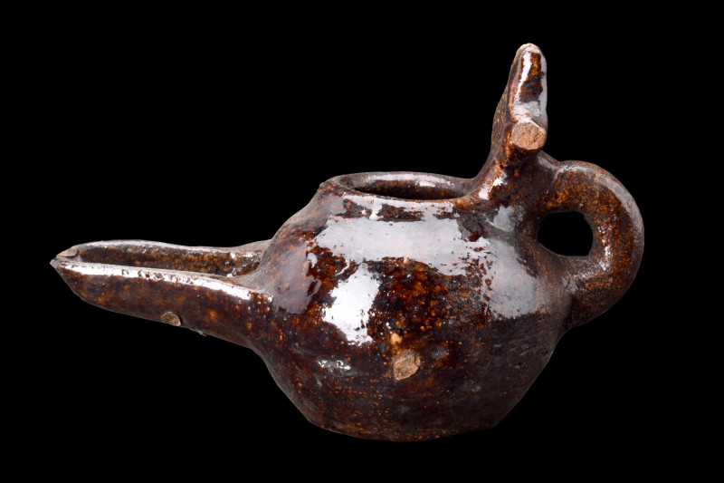 SELJUK BROWN GLAZE POTTERY OIL LAMP

 Ca. 1100-1200 AD
 A brown glazed potter...