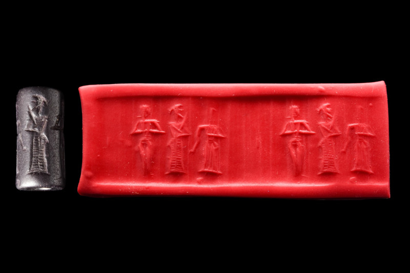 OLD BABYLONIAN BLACK STONE CYLINDER SEAL

 Ca. 1800-1600 BC
 It depicts a nak...