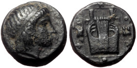 Ionia, Kolophon (ca 389-350 BC) AE (Bronze, 1.99g, 12mm)
Obv: Head of Apollo right, wearing tainia.
Rev: KOΛOΦΩ, Lyre with five strings within linear ...
