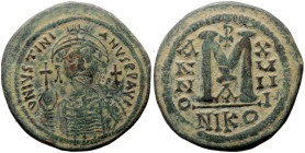 Justinian I (527-565) AE Follis (Bronze, 35mm, 19.68g) Nicomedia Dated year 18 (544/545). 
Obv: D N IVSTINI - ANVS P P AVC, Helmeted and cuirassed fac...