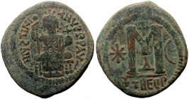 Justinian I (527-565) AE Follis (Bronze, 34mm, 15.73g) Theoupolis (Antioch), 531-537. 
Obv: D N IVSTINIANVS P P AVS, Justinian seated facing on throne...