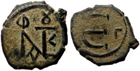 Justin II (565-578) AE Pentanummium (Bronze, 1.79g, 15mm) Constantinople
Obv: Monogram of Justin II 
Rev: Large E; Γ in right field.
Ref: Do.60 b1 - B...