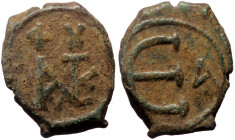 Justin II (565-578) AE Pentanummium (Bronze, 2.20g, 15mm) Constantinople
Obv: Monogram of Justin II 
Rev: Large E; A in right field.
Ref: Do.60 b1 - B...