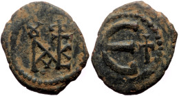 Justin II (565-578) AE Pentanummium (Bronze, 16mm, 1.84g) Constantinople mint. 
Obv: Monogram 
Rev: Large E; cross to right. 
Ref: DOC 60e; SB 364.