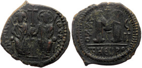 Justin II (565-578) AE Follis (Bronze, 30mm, 13.56g) Theoupolis (Antioch) 
Obv: Justin and Sophia enthroned facing, each holding a long sceptre, they ...