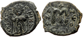 Islamic, Umayyad Caliphate. Arab-Byzantine imitations (ca 636-660) AE Fals (Bronze, 24mm, 5.12g) 
Obv: EN T(OV)TO NIKA, Crowned emperor standing facin...