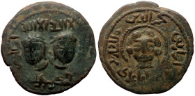 Islamic, Artuqids of Mardin, Najm al-Din Alpi AE Dirham (Bronze, 32mm, 14.63g) AH 560-566 / AD 1165-1172. 
Obv: Two diademed male heads facing slightl...