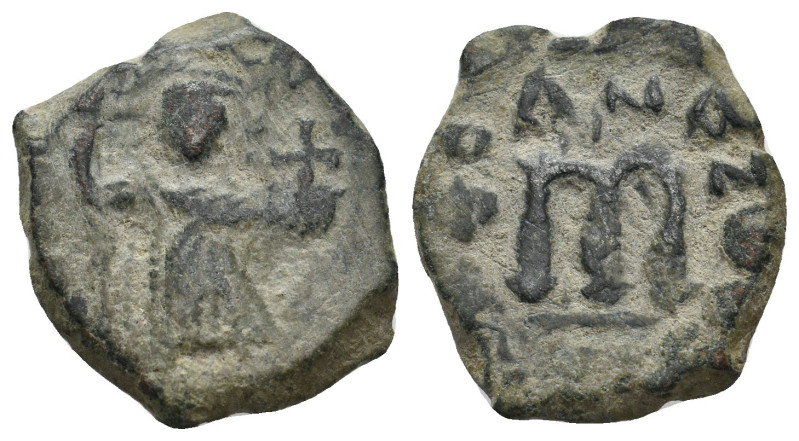 ARAB-BYZANTINE. Early Caliphate (636-660). Ae Fals.
5.7 Gr. 22.6 mm.