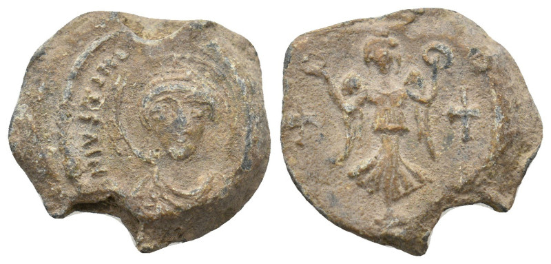 JUSTINIAN I (527-565). Lead seal.
7.52 Gr. 20.1 mm.