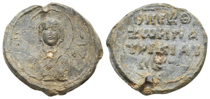 BYZANTINE LEAD SEALS.
9.41 Gr. 25.7 mm.