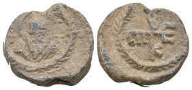 BYZANTINE LEAD SEALS.
9.35 Gr. 20.9 mm.