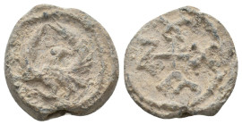 BYZANTINE LEAD SEALS.
8 Gr. 18.3 mm.