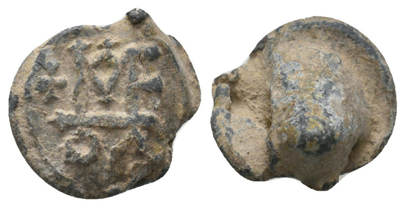 BYZANTINE LEAD SEALS.
4.54 Gr. 15.5 mm.
