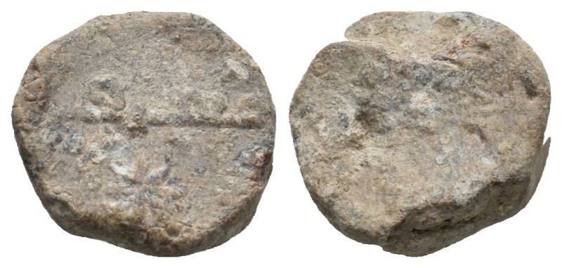 ISLAMIC LEAD SEALS.
5.64 Gr. 14.8 mm.