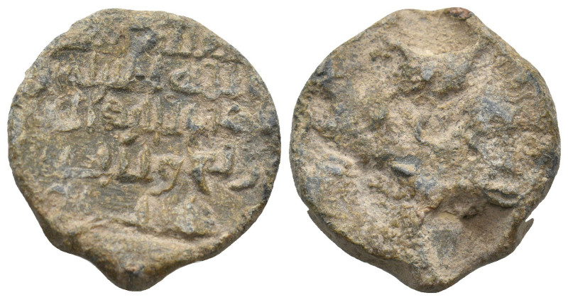 ISLAMIC LEAD SEALS.
15.95 Gr. 25.6 mm.