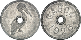 GABON
IIIe République (1870-1940). Jeton-monnaie au pélican, par Lindauer (non signé) 1928, Poissy.
Av. Pélican autour du trou central. 
Rv. GABON 192...