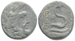 Mysia, Pergamon. AE, Circa 133-27 BC. 8 g 21,2 mm.
Obv: Laureate head of Asklepios to right.
Rev. AΣKΛHΠIOΣ – ΣΩTHPOΣ, Serpent coiled around omphalos....
