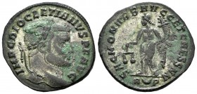 Diocleciano. Follis. 302-305 d.C. Roma. (Spink-12814). (Ric-111a). Rev.: SAC MON VRB AVGG ET CAESS NN. Moneta en pie a izquierda con balanza y cuerno ...