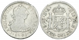 Carlos IV (1788-1808). 2 reales. 1791. Santiago. DA. (Cal-1037). Ag. 6,61 g. Busto de Carlos III y numeral del rey IIII. Golpe en el canto. Rara. BC+....