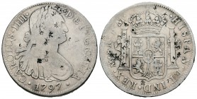 Carlos IV (1788-1808). 8 reales. 1797. México. FM. (Cal-691). Ag. 26,58 g. Resellos orientales. BC+. Est...60,00.