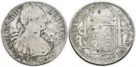 Carlos IV (1788-1808). 8 reales. 1800. México. FM. (Cal-695). Ag. 26,57 g. Resellos orientales. Oxidaciones. BC+. Est...55,00.