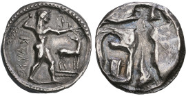 ‡ Italy, Bruttium, Kaulonia, stater, c. 500-480 BC, ΚΑΥΛΟ (retrograde), Apollo, naked, standing right with branch in right hand raised behind head; a ...