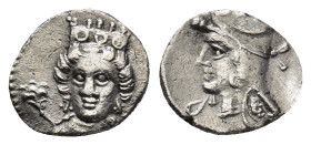 Cilicia, uncertain mint AR Obol. (10mm, 0.67g) 4th century BC. Head of female facing slightly left, wearing crown and earrings; rose to left / Head of...
