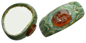 Ancient bronze ring with red gem stone
Lying stag curled back
3,65 gr - 19,03 mm