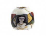 Egyptian Face Bead mosaic glass 
1st century BC - 1st century AD; height cm 1; Provenance: The Gotha Precious Collection: property of a Swiss Collect...