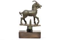 Roman Bronze Hanger in the form of a Bridled Goat
2nd - 3rd century AD; height cm 18 with support. Provenance: Private collection, acquired on the Ge...