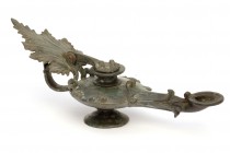 Roman Bronze Lamp With Vine-Leaf Handle
2nd - 3rd century AD; length cm 26. Reference: close comparison in British Museum (1856,1226.1005). Provenanc...