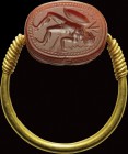 An intaglio on an etruscan carnelian scarab, mounted on an ancient gold ring. Capaneus (warrior struck by lightnings). The character can be identified...
