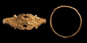 A greek gold ring. Two cranes. The engraved bezel has the shape of a Beotian shield (about the shape of the Boetian Shields, see. Greek coinages, e.g....