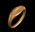 A greek gold ring. Warrior. The helmeted male character is turned to the right, his hand on the hip, and is leaning against his spear, the which he is...