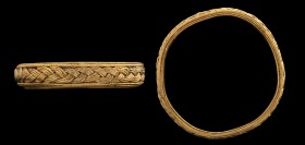 A greek gold ring. Intertwining decoration. Two bands, each formed by three conjoined threadlike elements, intertwined along the whole hoop, and are e...