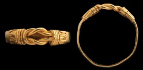 A greek gold ring. Hercules' knot. The ring is characterized by a flat hoop, ending with two connections (thicker, and worked with a dotted thread), f...