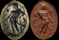 An etruscan iron intaglio. Hercules with club. The standing hero, turned to the left, is wearing the nemean lion skin; he is holding a laurel wreath i...