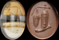 An italic banded agate intaglio. Auspicious allegorical emblem, made of a wheel flanked by an attribute (presumably some fished fishes, hanging from a...