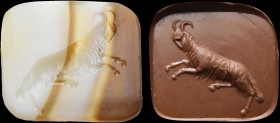 An italic banded agate intaglio. Rampant goat. The quadruped is jumping on ahead, exactly occupying the bezel diagonal. The animal's head intentionall...
