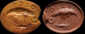 A roman yellow jasper intaglio. Eagle with attributes. The bird is ripping a hare, disembowelling it with its sharpened beak. In the field, a crescent...