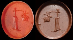 A roman carnelian intaglio. Wheel and butterfly. The insect has delicately landed on the wheel handle. Light wear marks. 1st century B.C. - 1st centur...